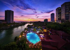 a city skyline with a river and a pool at Hilton Colombo Hotel in Colombo