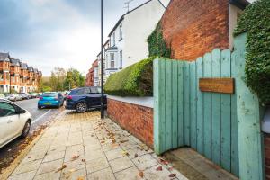 a green fence on the side of a house at Sorley Boys Snug in Derry Londonderry
