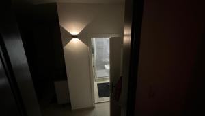 a hallway with a light on the wall at Am Gebirgsbad in Kurort Jonsdorf