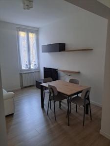 a dining room with a table and chairs at San Francesco Home in Terni