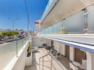 a balcony with a swimming pool on a building at Maresidence Rooms & Breakfast in Torre Pali