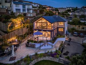 an aerial view of a house with a patio at 5 Bed in Fowey oc-93849 in Polruan
