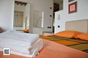 Postel nebo postele na pokoji v ubytování Agriturismo Nicobresaola