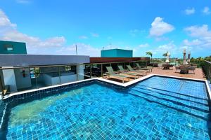a swimming pool on the roof of a building at Rooftop Tamandaré by Temporada Inn in Tamandaré