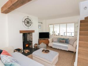 a living room with a couch and a fireplace at 36 Crowthers Hill in Dartmouth