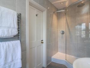 a bathroom with a shower with a glass door at 36 Crowthers Hill in Dartmouth +26 photos