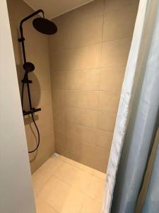 a shower with a shower curtain in a bathroom at AE323-Soby-Aero-Sondervejen-5 in Søby +7 photos