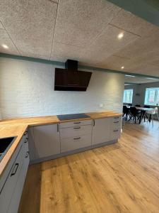 a large kitchen with a counter top in a room at AE323-Soby-Aero-Sondervejen-5 in Søby