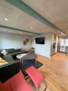 a living room with a couch and a table at AE323-Soby-Aero-Sondervejen-5 in Søby