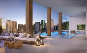 a living room with couches and a view of a city at Upscale Downtown Condo Pool Gym & Skyline Views in Miami