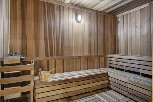 a wooden sauna with a bucket in it at Upscale Downtown Condo Pool Gym & Skyline Views in Miami