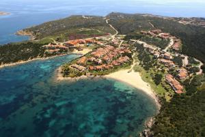 an aerial view of a resort on a beach at Cala Del Faro House in Arzachena