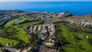 an aerial view of a golf course next to the ocean at Seaview Oasis Luxury Duplex La Caleta in Adeje