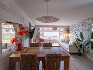 a living room with a table and chairs at Ermmoon Cottage in Erm