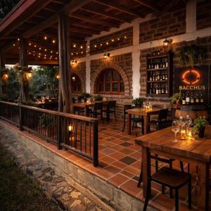 an outdoor patio with tables and chairs in a restaurant at Finca Hotel Tierra Verde in Girardota