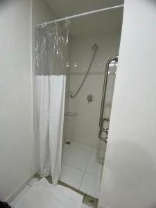 a bathroom with a shower with a shower curtain at Samba Rio Bonito in Rio Bonito +16 photos