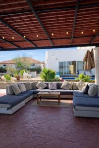 a living room with couches and a coffee table at The Colony La Ventana in La Ventana
