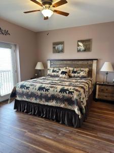 a bedroom with a bed and a ceiling fan at Mountain View Condo 3702 in Pigeon Forge +43 photos