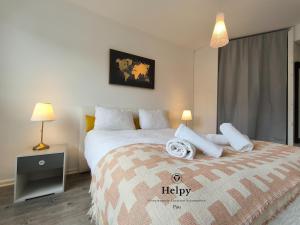 a bedroom with a large bed with white pillows at Spacious Quiet Pyrenees View Garage in Pau