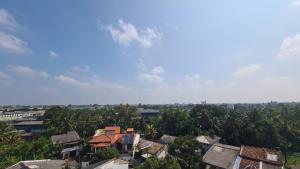 an overhead view of a city with houses and trees at Oceanway Residences in Wattala