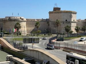 a view of a city with a large building at Emy Suites in Civitavecchia +116 photos