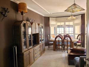 a kitchen and dining room with a dining table at Casa Chalet El Bucanero Morro Jable in Morro del Jable