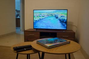 a television sitting on top of a wooden table with a coffee table sidx sidx sidx at 11 St Joseph in Birgu