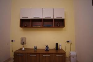 a room with a wooden cabinet and a toilet at 11 St Joseph in Birgu +24 photos