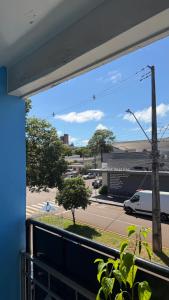 a view of a street from a balcony at Pousada da Salete in Campo Mourão