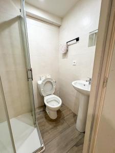 a bathroom with a toilet and a sink at Studio - Centre Ville in Sartrouville