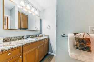 a bathroom with a sink and a mirror at North Street Escape in Ruidoso +39 photos