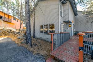 a house with a wooden ramp leading to the front door at North Street Escape in Ruidoso
