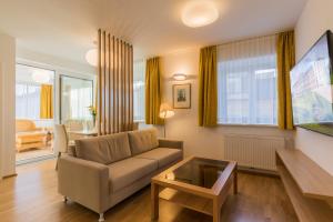 Телевизор и/или развлекательный центр в Vienna Grand Apartments City