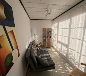 a living room with a couch in a room at FeWo zum Der Hilderser in Hilders