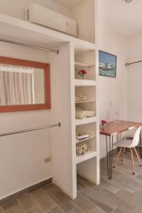 a dining room with a table and a window at The Colony La Ventana in La Ventana