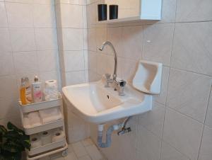 a bathroom with a sink and a urinal on the wall at on the STRIP-Studio 1 in Kavos +37 photos
