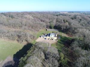 an aerial view of a large house in the woods at 1 Bed in Northrepps oc-1736 in Northrepps