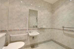 a bathroom with a toilet and a sink at 2 Bed in Cowling oc-ds238 in Cowling +10 photos