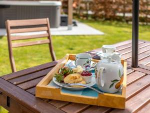a tray with a tea set on a table at 2 Bed in Launceston oc-41992 in Saint Giles on the Heath