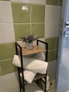 a small table with towels and a plant on it at "Chez Maria" in Stroumbi +25 photos