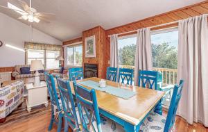 a dining room with a table and chairs at Misty Blue - Corolla, Ocean Sands, 200 Yards to Beach, Ocean View, Pets OK, Flex Stays Year Rnd in Corolla +24 photos