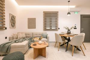 a living room with a couch and a table at Alavastros City Center in Zakynthos