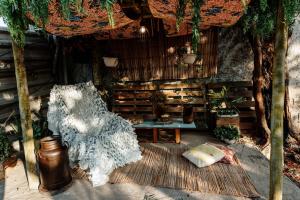 a living room with a chair and a table at Country house, peace comfort & love in Contagem +34 photos