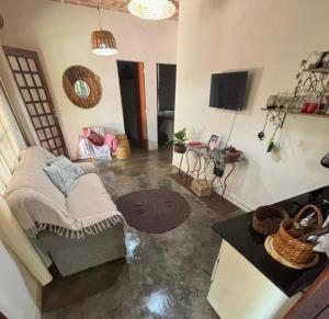 a living room with a couch and a table at Bosque Love in Juatuba