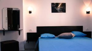 Postel nebo postele na pokoji v ubytování Hotel Métropole Résidence