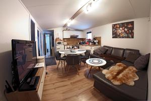a living room with a couch and a table at Chata Bella Donovaly in Donovaly
