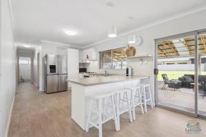 a kitchen and living room with a large window at Sea Chain in Lancelin