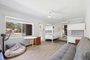 a living room with a couch and a table at Sea Chain in Lancelin