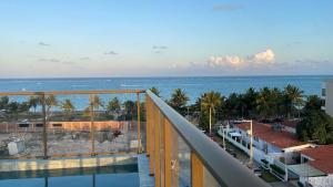 a view of the ocean from the balcony of a building at Conforto e Sofisticação à Beira Mar in Cabedelo