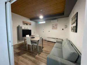 a living room with a couch and a table at Luma Sixty nine in Alcamo